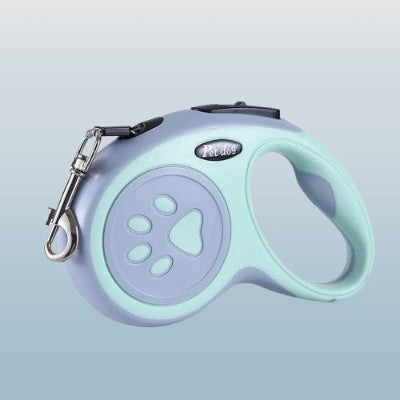 laisse enrouleur chien vert clair avec poignee ergonomique motif patte et mousqueton metalique