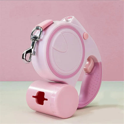 laisse a enrouleur pour chien retractable rose avec poignee ergonomique crochet metalique et distributeur de sacs integre